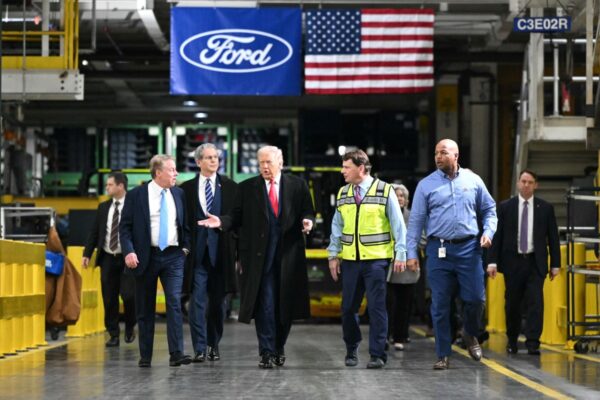 US President Donald Trump tours a manufacturing plant